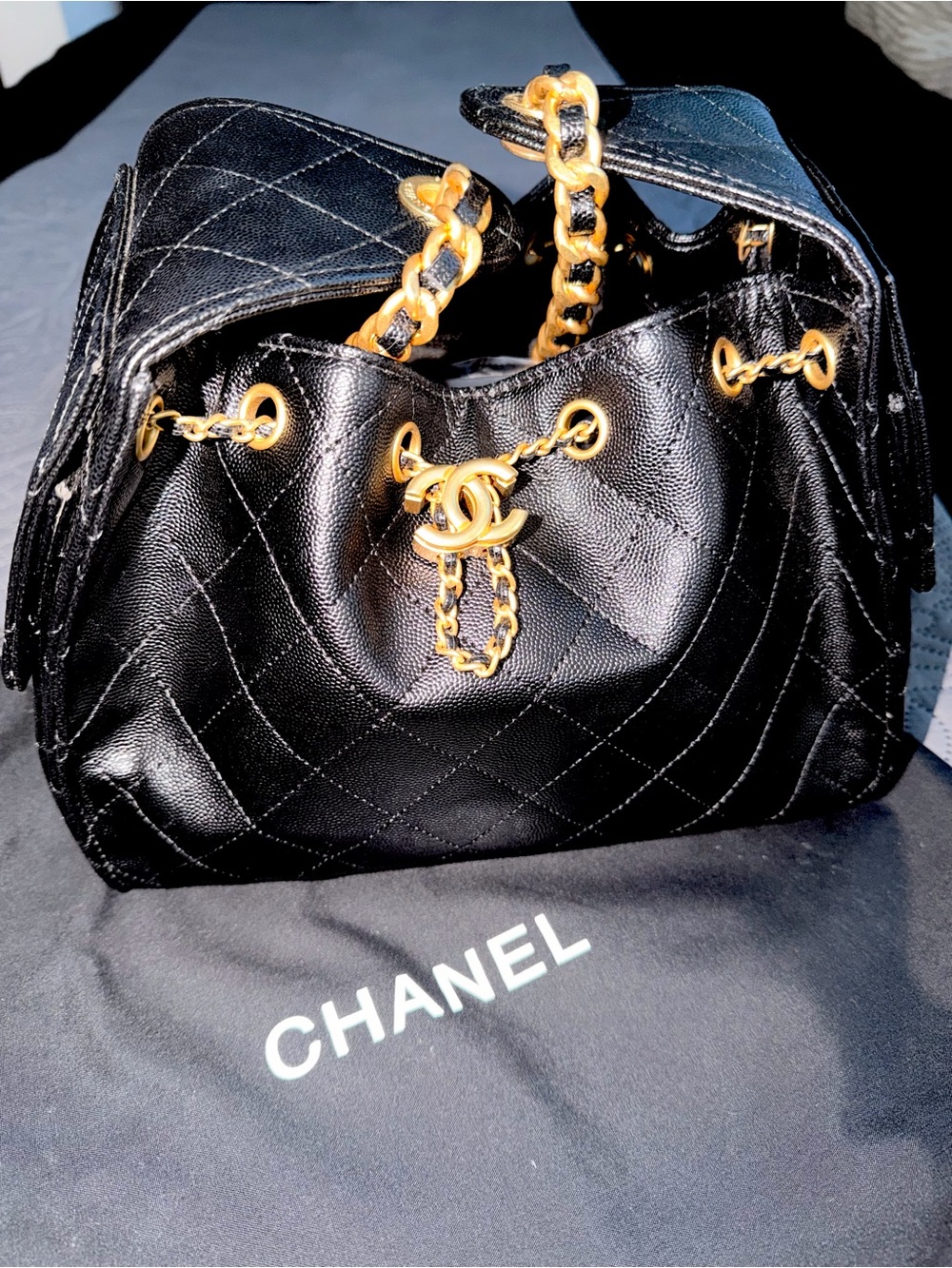 CHANEL Black Quilted Lambskin Drawstring Shoulder Bag with Gold Hardware